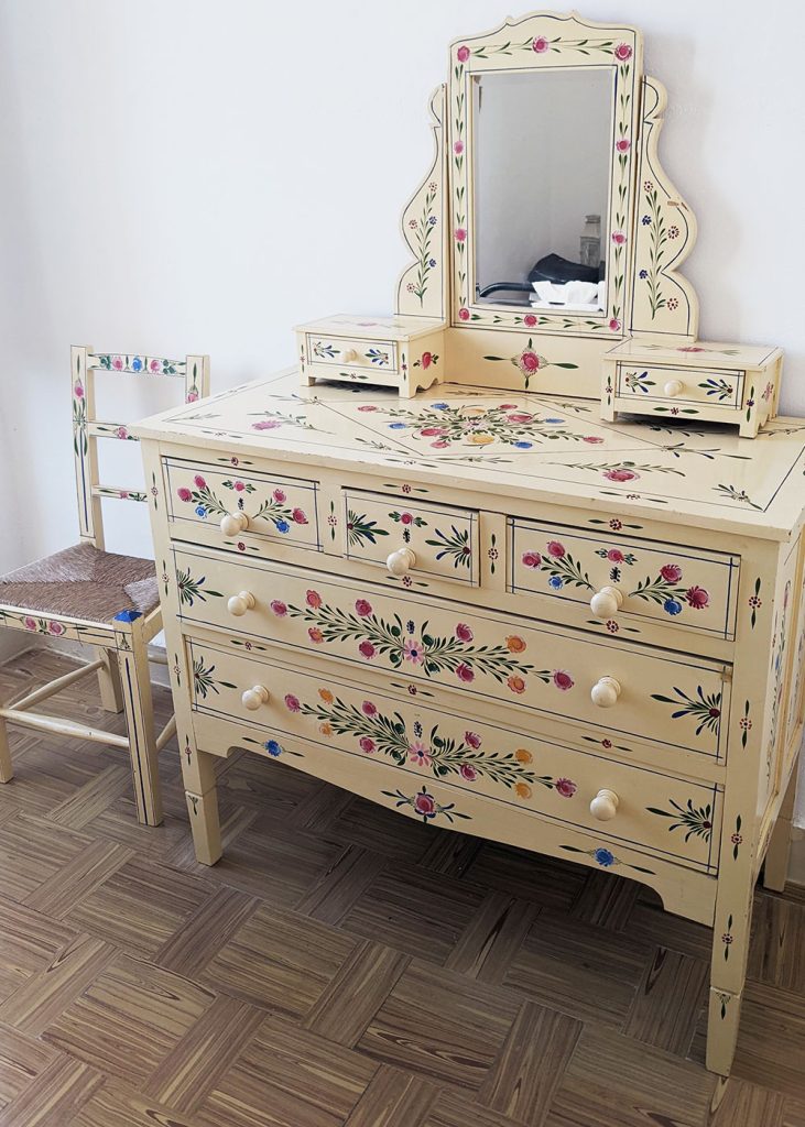 Alentejo furniture is hand-painted with folk flower motifs