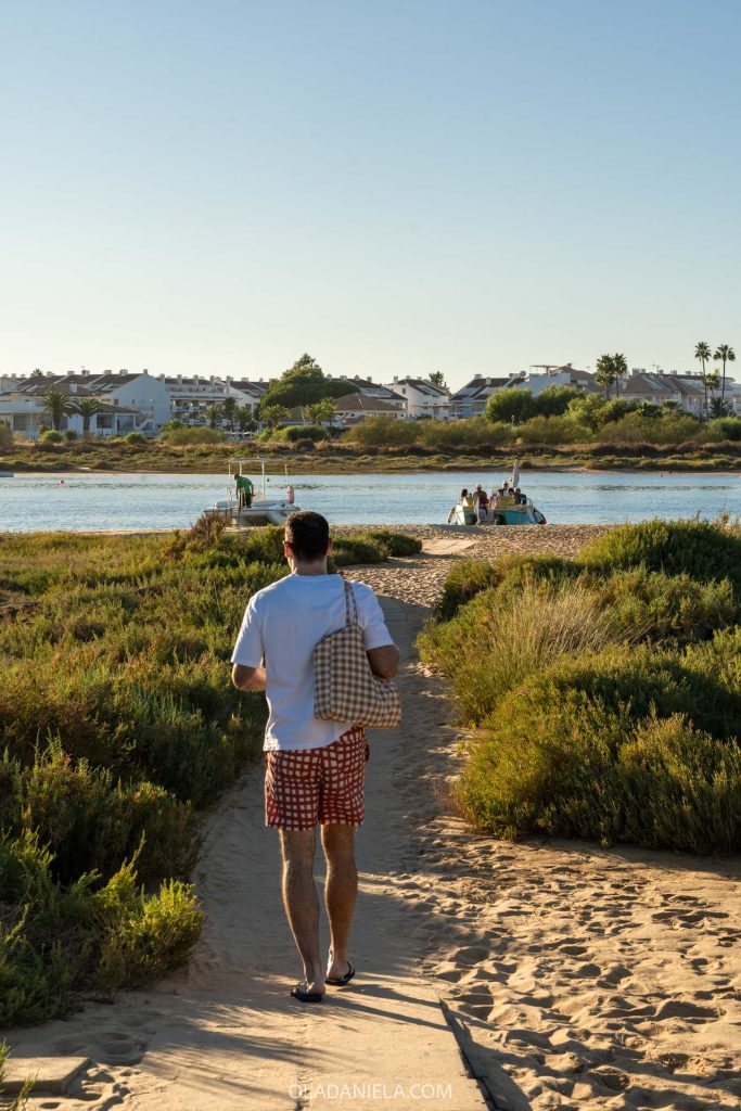 A man walking back to the ferry boat at Cabanas in Tavira, Algarve