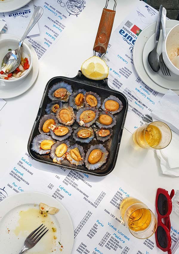 Grilled limpets in a pan from above