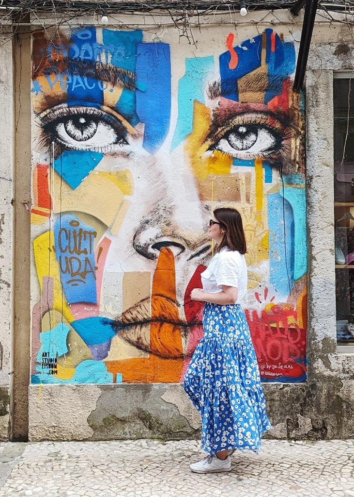 Walking past street art in the LX Factory, Lisbon, Portugal