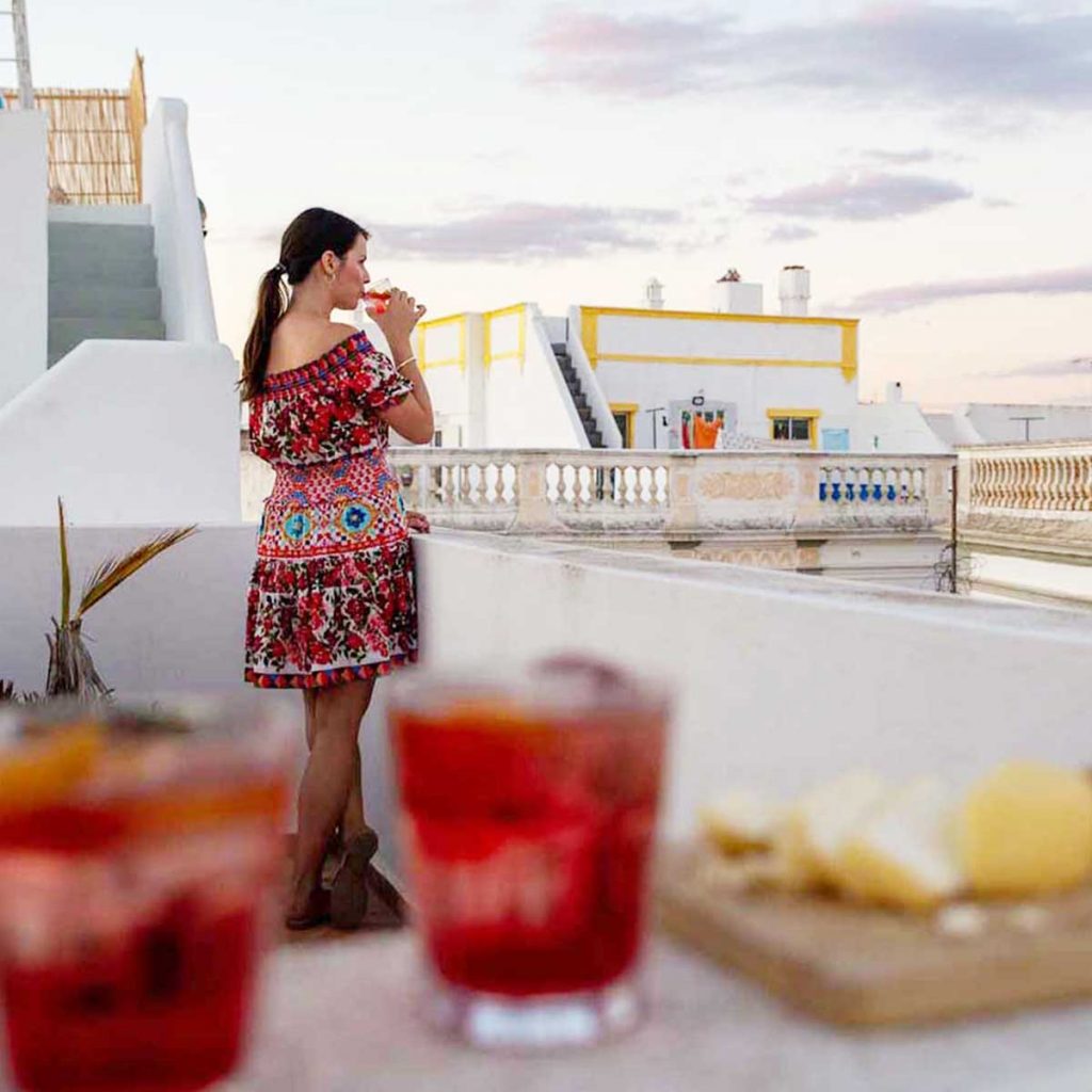 Things to do in Olhão include drinking on your roof terrace while the sun sets