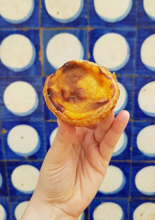 pastel de nata or Portuguese custard tart with tiles