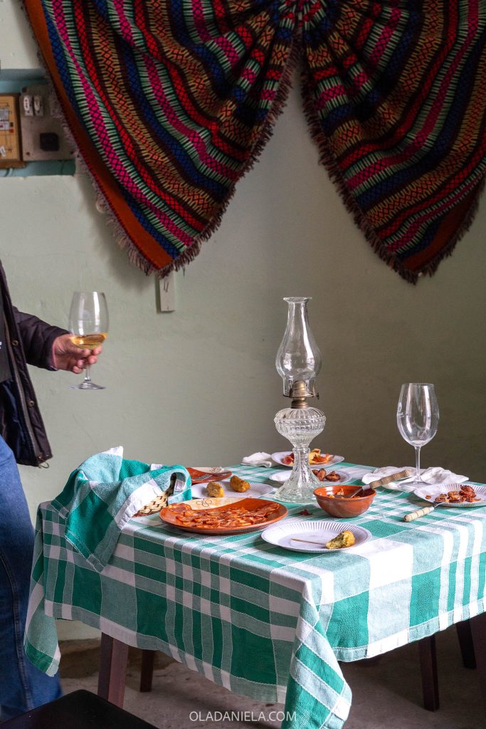 A table of food inside Mercearia Fim do Mundo (End of the World Grocer), a historic store in Redondo, Alentejo