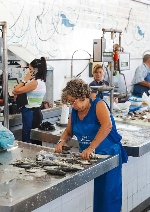 Fish lady at Mercados do Olhão in the Algarve